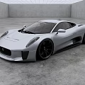Sleek Silver Jaguar Sports Car In Modern Studio With Gray Floor And White Ceiling