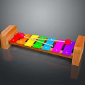 Colorful Wooden Xylophone with Multicolored Keys and Red Mallets on Dark Glossy Surface