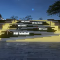 Stepped Road Facilities with Illuminated Steps in Night Scene Surrounded by Trees and Sports Signs