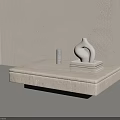 Modern Minimalist Coffee Table with Light Top Sculptural Vase Stack of Books and Small Cylinder in Interior