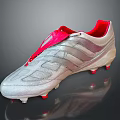 Silver Soccer Cleats With Red Laces Striped Upper And Studded Sole Design