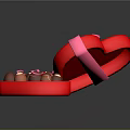Open Red Heart Shaped Box With Pink Ribbon Bow And Assorted Chocolates