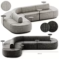 Modern Gray Fabric Sectional Sofa With Curved Modular Design And Small Round Side Tables