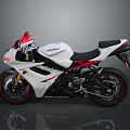 Sporty Suzuki Motorcycle With White Body Red Accents And Black Seat