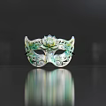 Decorative Green And White Mask With Lotus Flower Center And Intricate Scroll Patterns