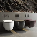 Modern Wall Mounted Toilets in White Black and Burgundy with Flush Buttons on Gray Wall