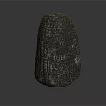 Black Stone Sculpture With Intricate Glowing Green Pattern And Decorative Design