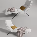 White Modern Lounge Chair With Brown Pillow And Striped Throw On Metal Legs