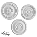 Three White Decorative Circular Ceiling Components With Layered Design Details