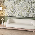 White Sectional Sofa on Wooden Base with Green Botanical Wallpaper and Floor Lamp