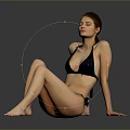 Woman In Black Bikini Sitting On Reflective Floor With Grey Black Gradient Background