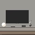 White TV Stand With TV Round Lamp Clock And Rabbit Decor Near Potted Plant