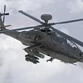Advanced Military Attack Helicopter Flying High in Cloudy Sky with Rotors and Weapons