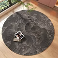 Round Area Rug With Floral Pattern On Wooden Floor Featuring Potted Plant And Magazine