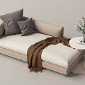 Cozy Beige Sofa Bed With Gray Pillows Brown Blanket Small Round Table Green Plant Books
