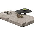 Modern Stacked Stone Coffee Table With Books Decorative Figurines And Fruit Bowl