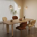 Modern Dining Room With Wooden Table Beige Brown Chairs Pendant Lights And Potted Plants