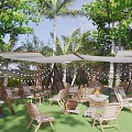 Scenic Outdoor Campsite With Palm Trees White Canopies String Lights And Wooden Furniture