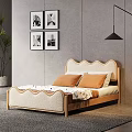 Double Bed With Scalloped Beige Headboard Wooden Frame Orange Pillows And Black White Wall Art Green Plant Bright Light