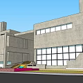 Modern Concrete Building Exterior With Large Windows And Steps Under Blue Sky