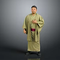 Man Wearing Green Kimono With Red Belt Standing With Hands On Chest Against Gray Background