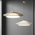 Pair Of Modern Layered Pendant Lights With Minimalist Design And Soft Glow