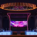 Modern KTV Interior With Neon Lights Large Screen Bar Counter And Seating Area