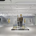 Modern Clothing Store Interior With Mannequins Dressed In Jackets Clothes On Display And Bright Lighting