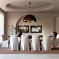 Modern Restaurant Interior With White Dining Table Gray Chairs And Round Pendant Light