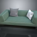 Modern Green Sectional Sofa with Gray and White Pillows and Metal Legs