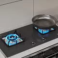 Black Gas Stove With Two Blue Flames And Pan On Burner Countertop