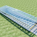 Road Infrastructure with Glass Roof and Metal Frame Set on Green Grass Under Blue Sky