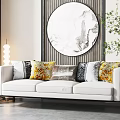 White Three-Seater Sofa With Colorful Patterned Cushions And Circular Marble Wall Art