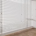 White Window Blinds In Modern Room With Wooden Floor And Indoor Plant