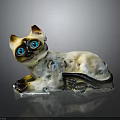 Siamese Cat With Blue Eyes And White Brown Fur Lying Ceramic Figurine On Dark Surface