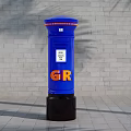 Blue Commercial Post Box With GR Logo Standing Against Brick Wall 3d model