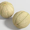 Two Fresh Juicy Cantaloupe Melons With Netted Skin And Green Stripes