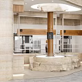 Modern Dessert Shop Interior With Cashier Counter Wooden Shelves And Rock Decor