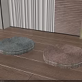 Round Woven Floor Cushions in Gray and Brown on Wooden Floor with Plant Pot