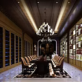 Elegant Club Interior With Long Dining Table Leather Chairs Chandelier and Wine Racks