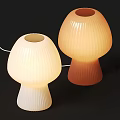 Mushroom Shaped Table Lamps White and Orange with Ribbed Shades on Black Background