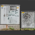 Old Weathered Electrical Utility Boxes With Graffiti And Green Grass Base