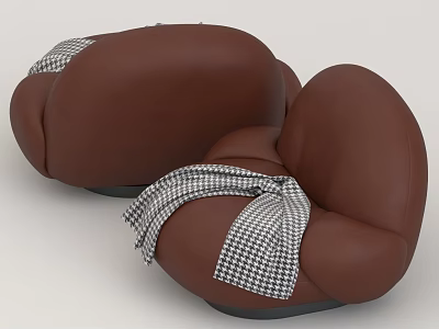 Two Brown Bean Bag Chairs With Black And White Checkered Blanket 3d model