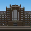 Symmetrical Red Brick School Building With Arched Entrance Tower Surrounding Lawn And Flower Beds