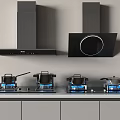Modern Kitchen Appliances Featuring Range Hoods And Gas Stoves With Cooking Pans