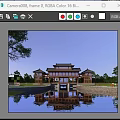 Traditional Chinese Style Office Building With Wooden Structure Overhanging Eaves And Scenic Pond Reflection