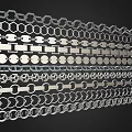 Various Decorative Metal Chain And Hexagonal Circular Patterns Arranged Neatly On Black Background