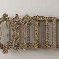 Ornate Golden Photo Frames With Intricate Carvings And Various Shapes Arranged Together