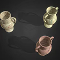 Green Decorative Plants in Colorful Speckled Vases with Handles on Black Background