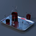 Silver Tray With Wine Bottle Wine Glass And Red Liquid In Glasses